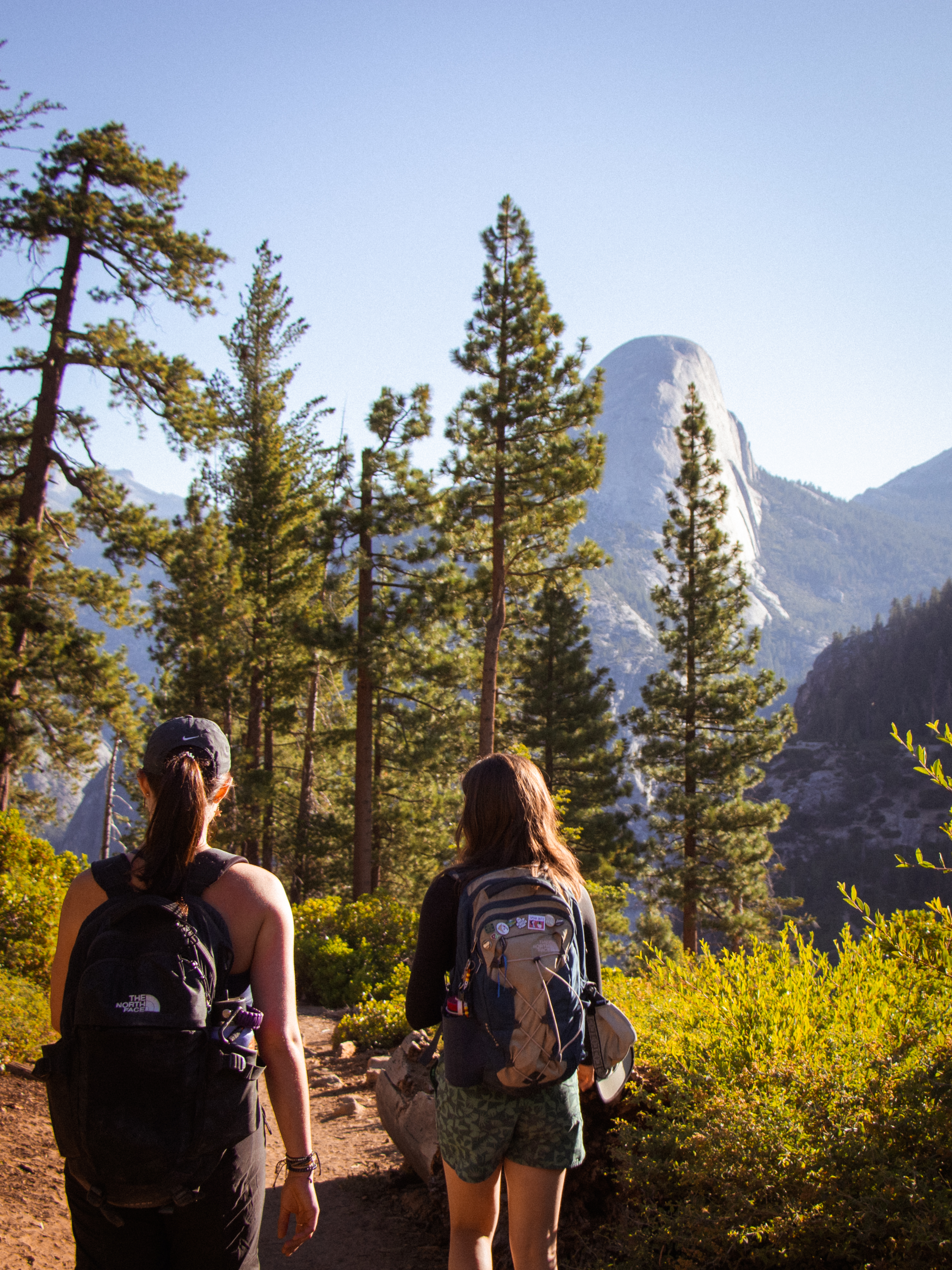 girls hiking away from